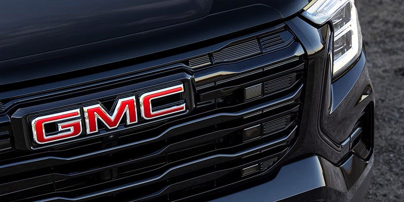 Close up view of Buick emblem on the grill of a GMC Yukon